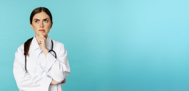 young-female-doctor-hospital-worker-white-coat-thinking-looking-away-thoughtful-searching-sol_1258-121336.jpg