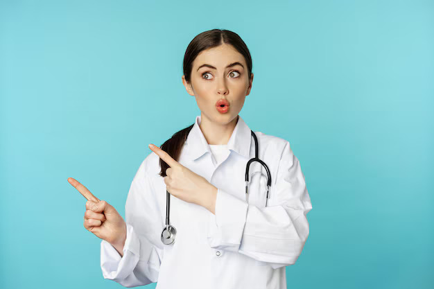 surprised-female-doctor-physician-with-stethoscope-pointing-looking-left-with-amazed-wow-face-standing-torquoise-background_1258-87679.jpg